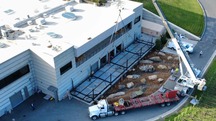 Lifting steel frame onto columns at Opus One Winery in Oakville, CA