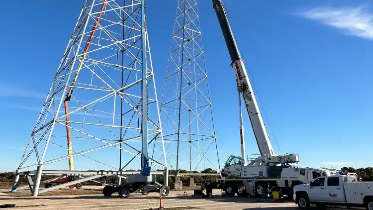 Topping out a new transmission tower